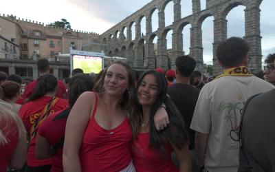 Two young women stand together in Segovia, Spain