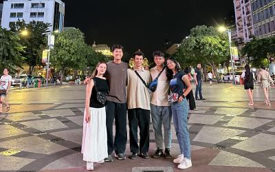 A group of friends standing in a town square in Vietnam