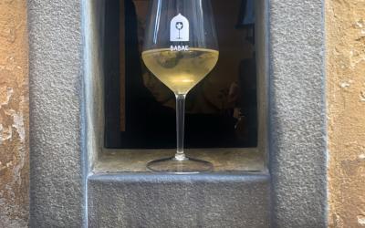 A glass of wine in a wine window in Italy